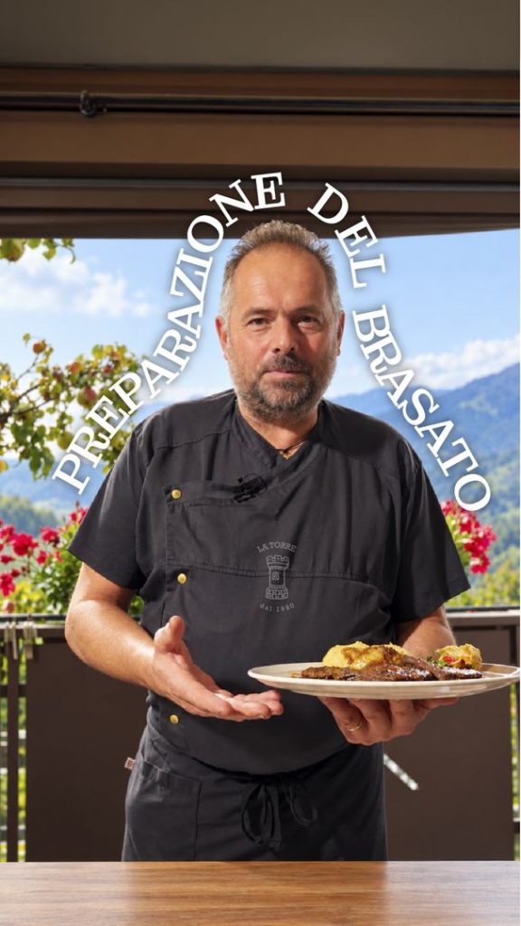 Copertina del video Preparazione del brasato: lo chef del Ristorante La Torre con il piatto in mano